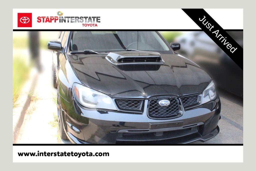 2007 Subaru Impreza WRX STi in Obsidian Black Pearl — front three-quarter view