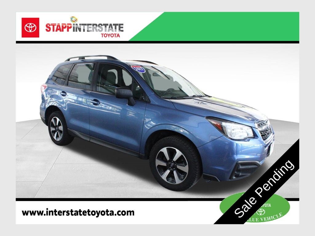 2017 Subaru Forester 2.5i in Quartz Blue Pearl — front three-quarter view